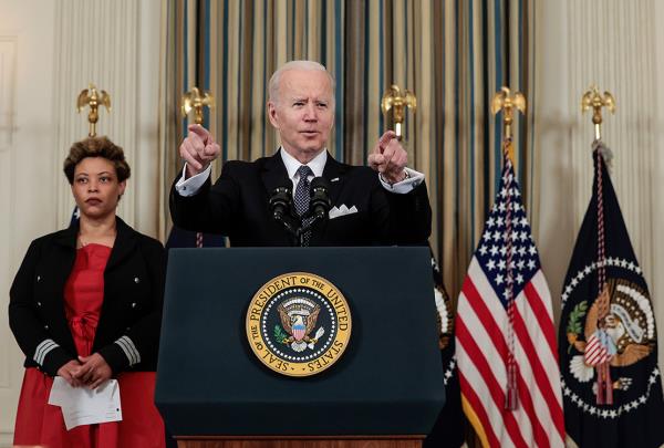 President Biden during remarks this afternoon. To his side is Office of Management and Budget Director Shalanda Young.